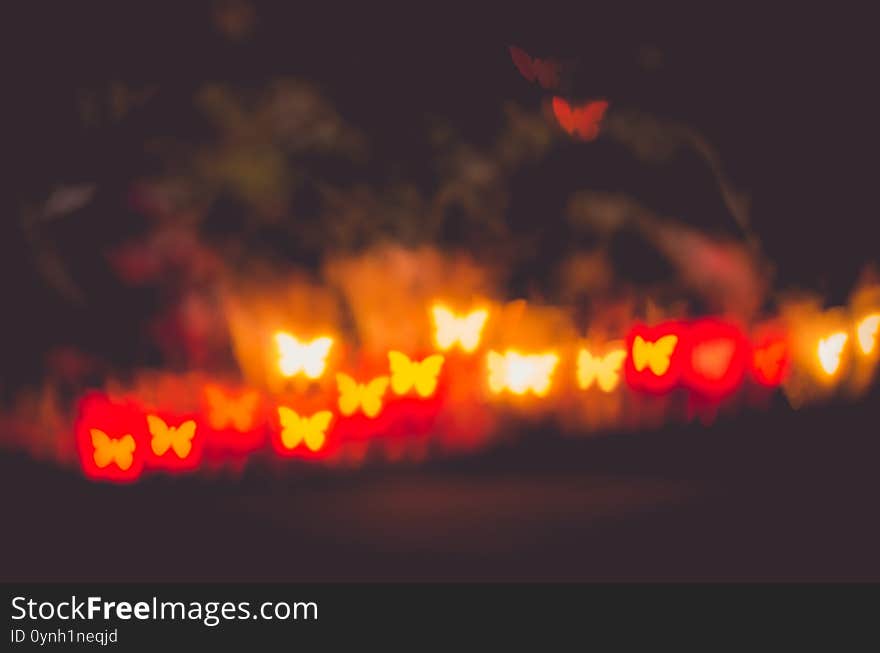 Vibrant red butterfly colored bokeh abstract  background