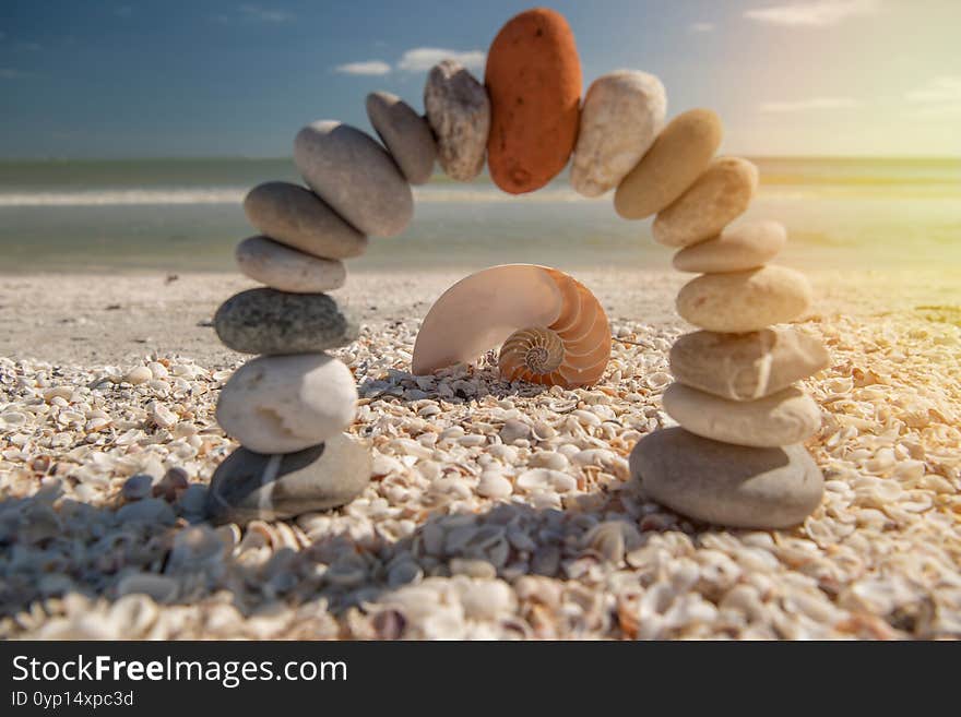 Red On Top. Stone Arch At Coastal Dream. White Shellings And Beach Scene.