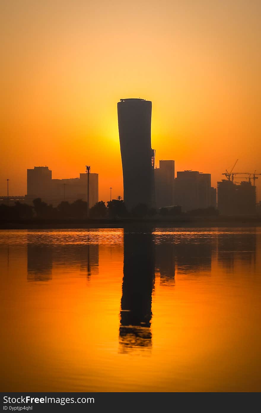 Sunrise Sky view background behind capital gate tower of Abu Dhabi, Skyscrapers in Capital city of United Arab Emirates. Sunrise Sky view background behind capital gate tower of Abu Dhabi, Skyscrapers in Capital city of United Arab Emirates