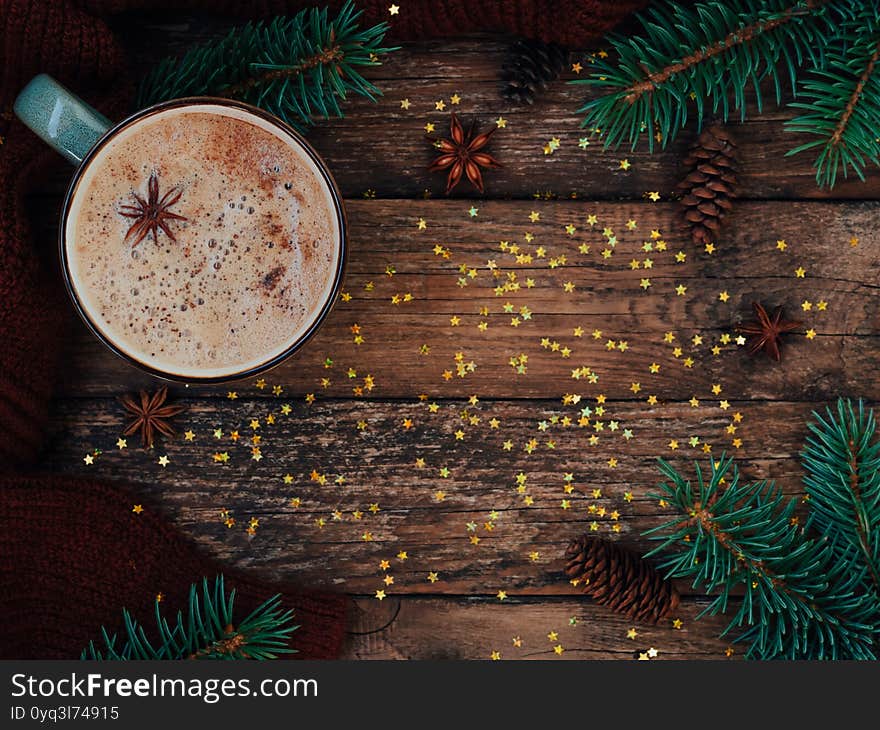 Holiday card for the new year is 2021 in warm, trendy colors. Christmas composition of fir, cup of coffe, cones, anise, cozy