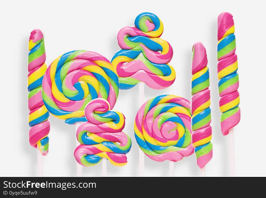 Set of colorful lollipops on white background.