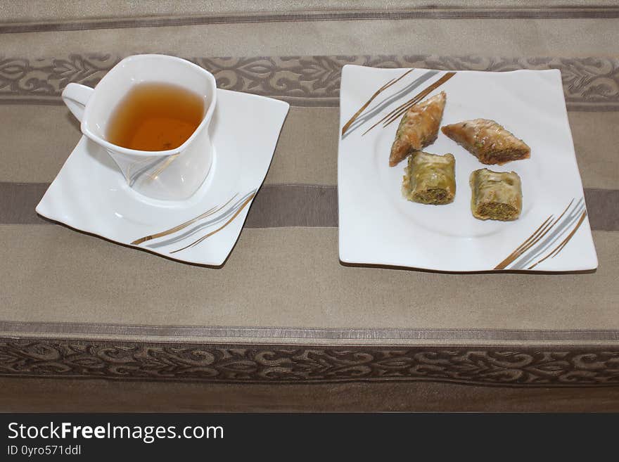 Tasty Fresh Baklava in Plate with tea