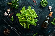 Vegetarian Food. Green Spinach Pancakes With Vegetables On A Black Stone Plate. Top View. Free Space For Your Text Royalty Free Stock Photography