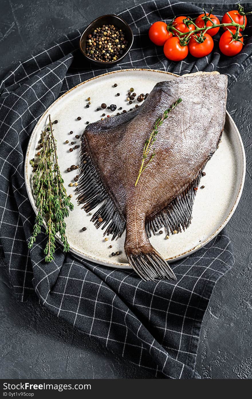 John Dory Fish With Pink Pepper And Thyme. Black Background. Top View