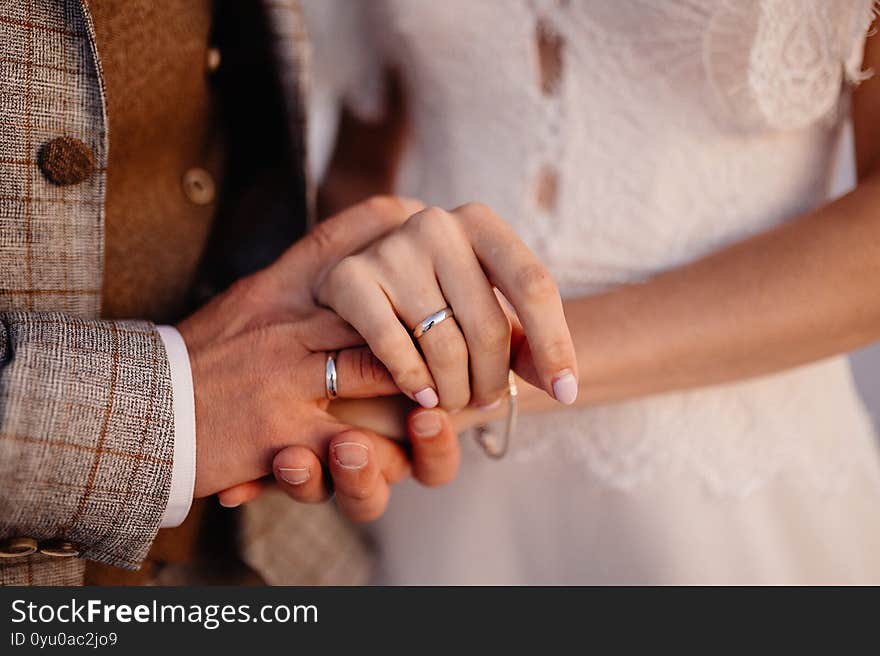 Man and woman hold hands close up