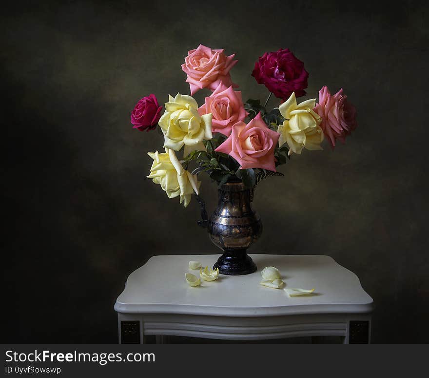 Still life with bouquet of roses in a vase