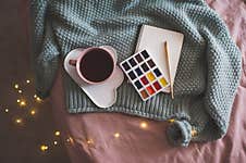 Cozy Knitted Sweater With Cup Of Tea Stock Image