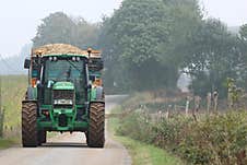 Tractor Bringing In The Maize Harvest Royalty Free Stock Images