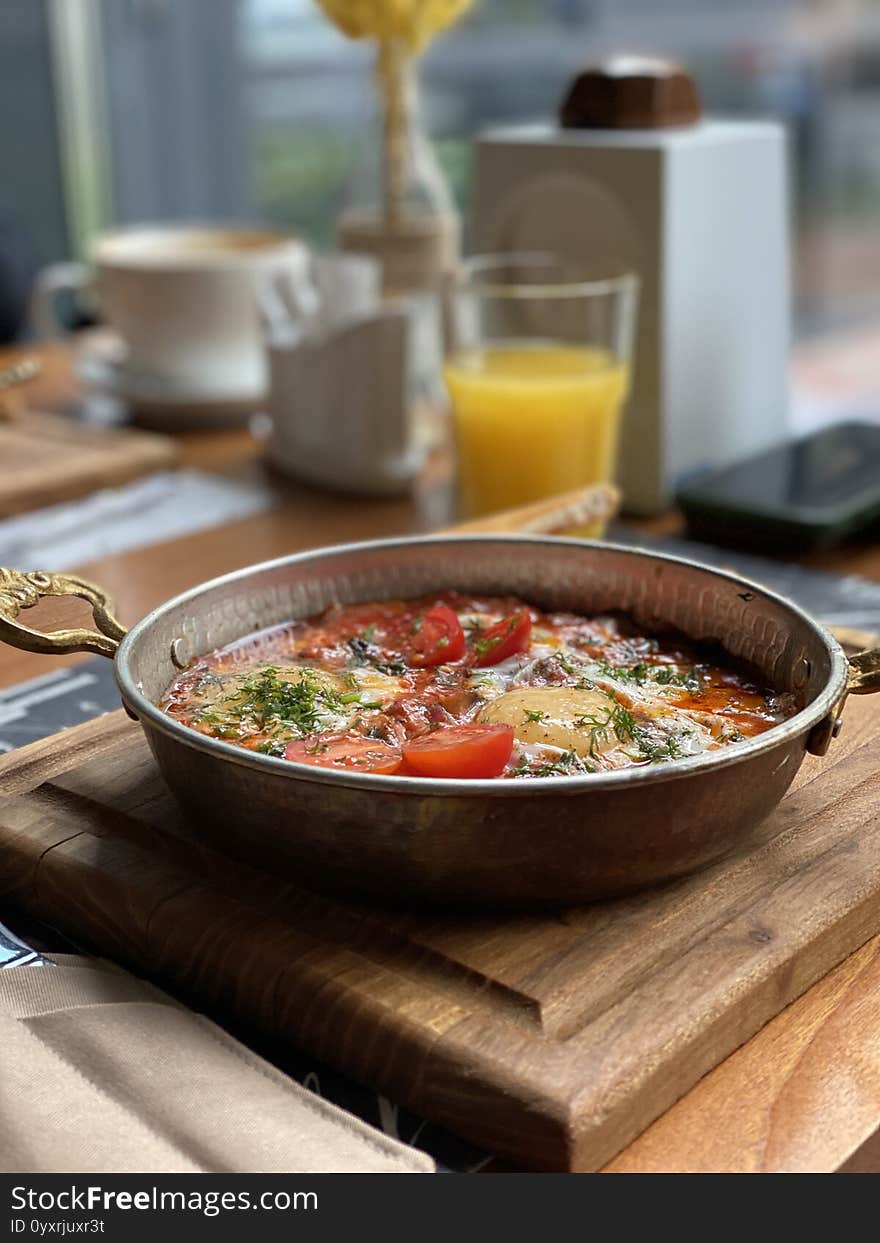 Vegan omelet with tomatoes, potatoes, eggs and juice. Vertical photo. Vegan omelet with tomatoes, potatoes, eggs and juice. Vertical photo