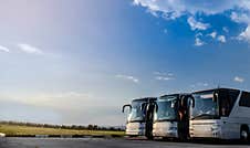 Buses Parking On A Blue Sky With Copy Space Stock Photos