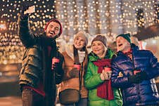 Photo Of Big Family Four Members X-mas Gathering Hold Mug Make Selfie Telephone Videocall Wear Outerwear Hat Scarf Coat Royalty Free Stock Photo