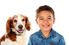 Two Friends Looking At Camera. A Child And His Dog Royalty Free Stock Photography