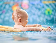 Baby Having Fun In The Swimming Pool Royalty Free Stock Images