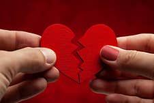 Man And Woman Break Off Relationship. Broken Heart. Crack In The Red Heart, Breaking The Relationship Stock Image