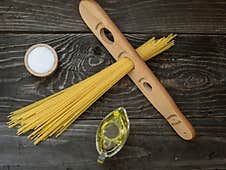 Spaghetti Wooden Measure, Olive Olil And Salt On Wooden Table Royalty Free Stock Photos