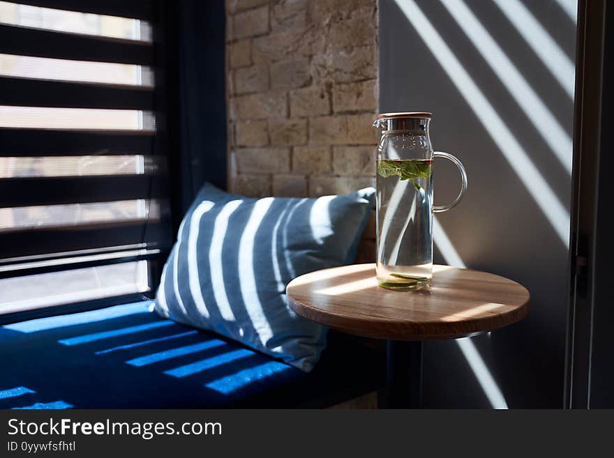 Bottle Of Water Standing On Wooden Table