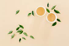 Cup Of Fresh Green Tea With Tea Leaves. Flat Lay, Top View. Tea Concept Stock Photo