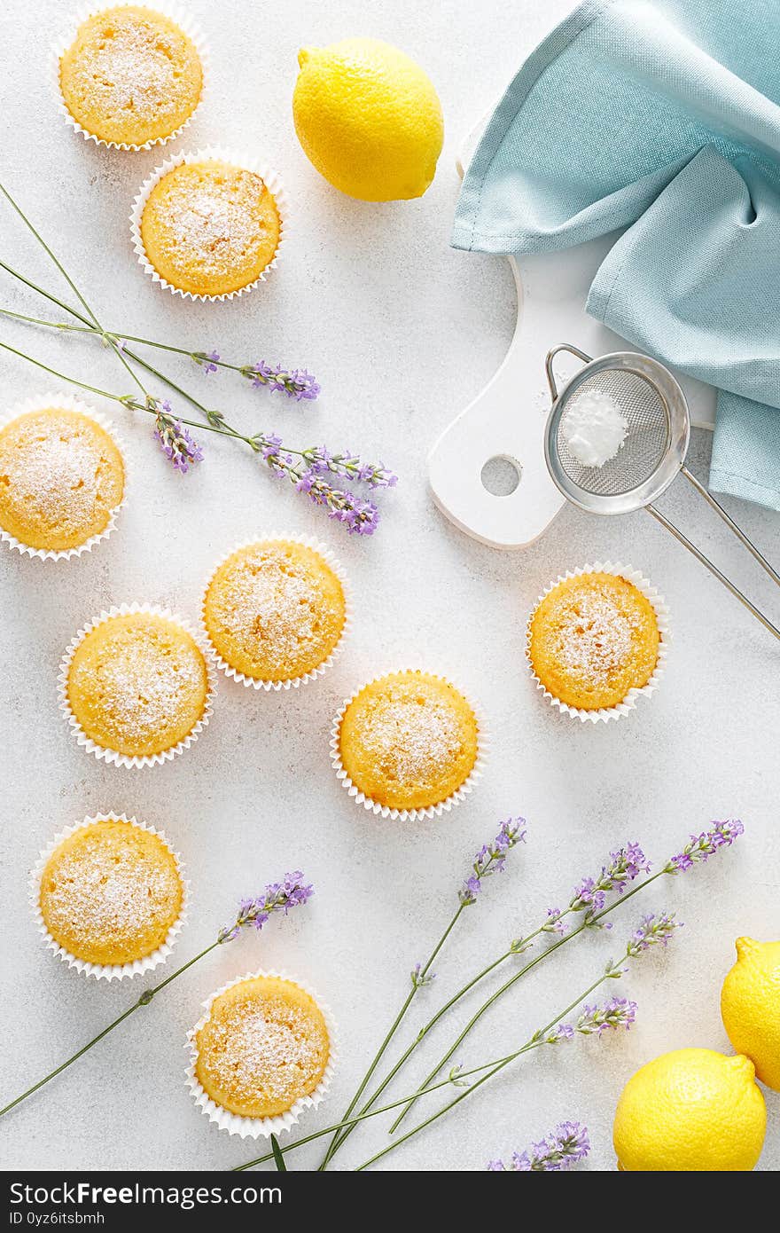 Lemon muffins with sugar powder, top down view