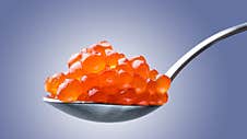 Salmon Red Caviar On A Spoon. Fish Caviar. Raw Seafood. Luxury Delicacy Food. Royalty Free Stock Photo