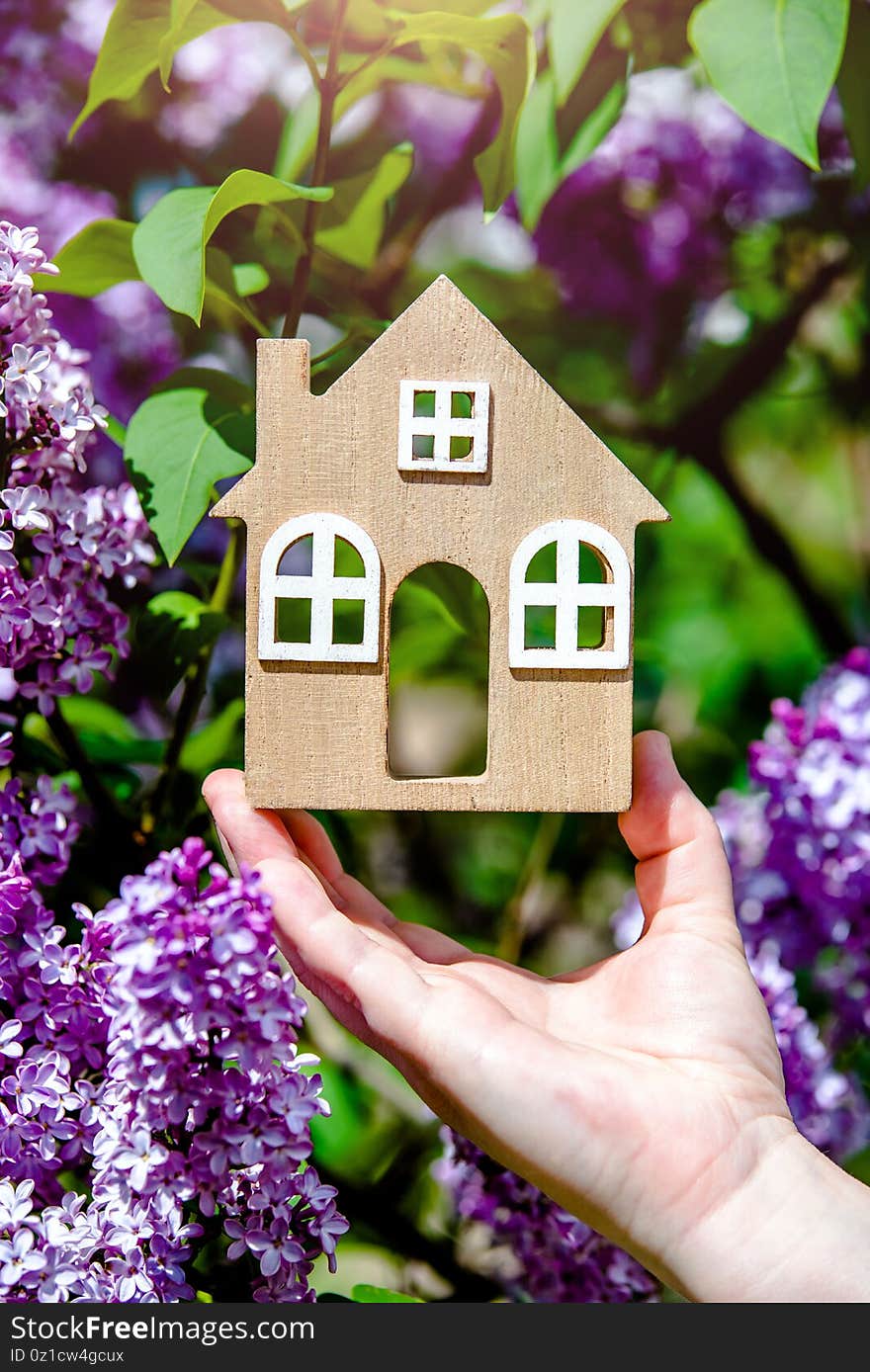 The girl holds in her hand the symbol of the house