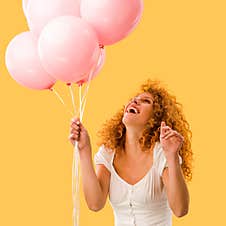 Excited Beautiful Redhead Woman With Pink Balloons Royalty Free Stock Images