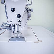 Sewing Machine. In The Foreground A Mechanism With A Needle And Thread Stock Image