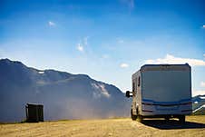 Camper Car On Roadside In Norwegian Mountains Stock Photos