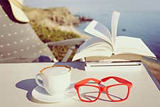 Coffee Cup And Books Outdoors Royalty Free Stock Photos