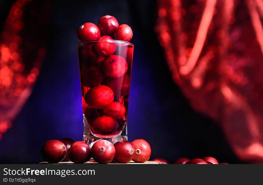 Shot Glass Filled With Cranberry Juice And Cranberries