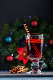 Mulled Wine In Glass Mug. Hot Red Wine With Fruits And Spices Stock Photos