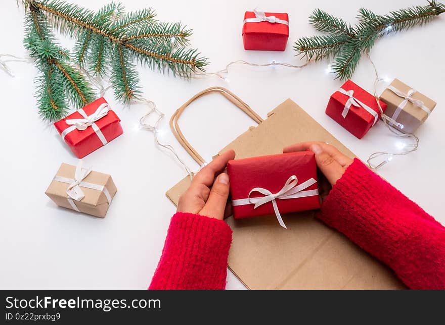 Gift hand package white background red bag delivery christmas tree