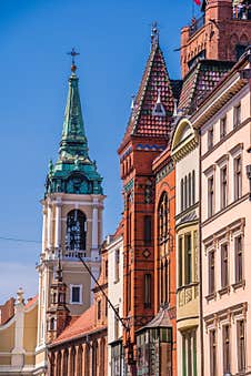 Church Of The Holy Spirit Surrounded By Buildings Under The Sunlight And A Blue Sky In Torun, Poland Royalty Free Stock Photos