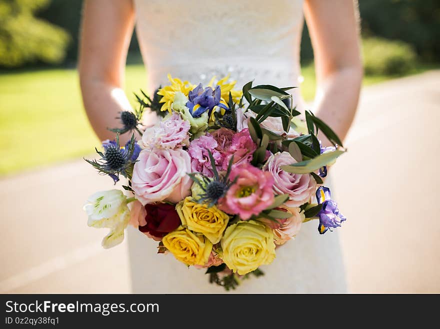 Bride hands with Wedding beautiful bouquet close-up