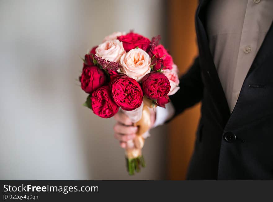 Bride hands with Wedding beautiful bouquet close-up