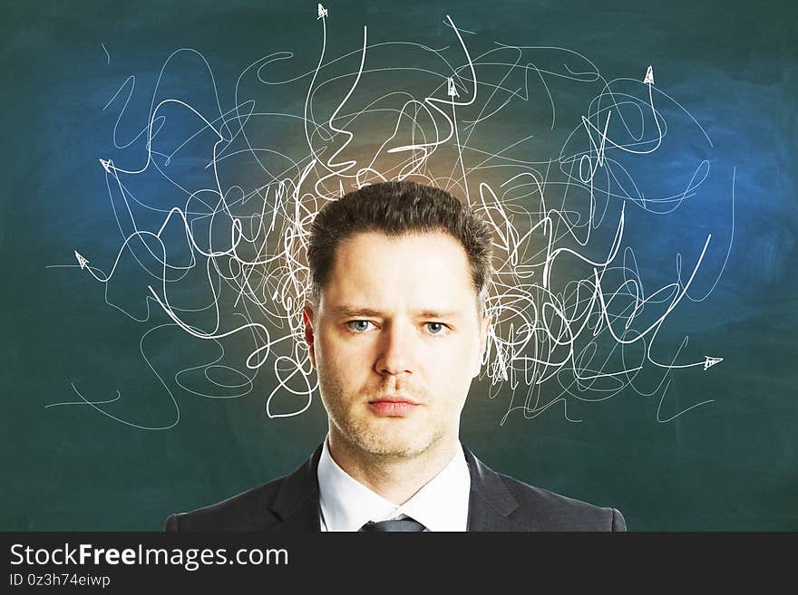 Businessman with drawing arrows over head