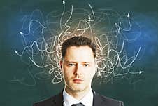 Businessman With Drawing Arrows Over Head Stock Photos