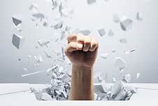 Fist Breaks The Concrete Floor Stock Photography