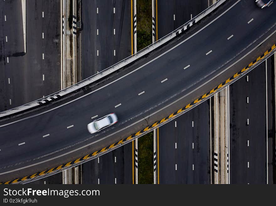 Aerial view traffic car transportation freeway motorway and ring road at evening moving car long exposures shot