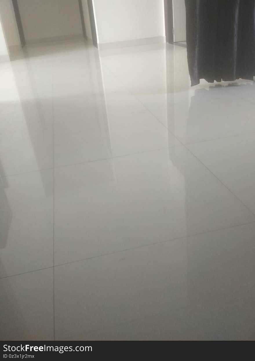 White tiles royal floor surface in a apartment in India