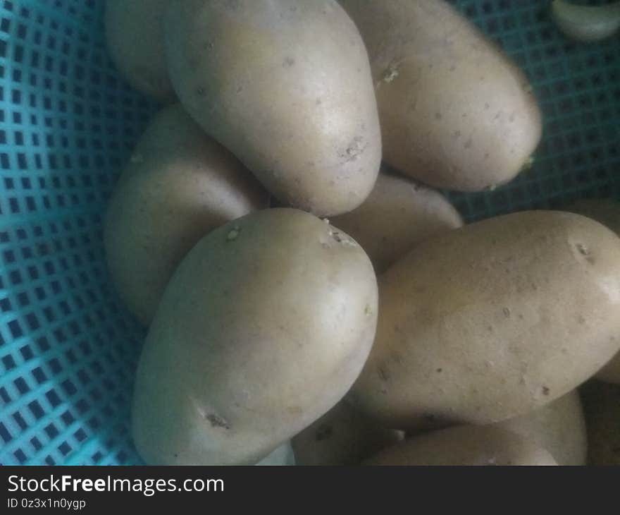 Fresh potato or aalu the source of carbohydrates in a basket