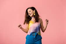 Young Stylish Disco Girl Dancing Isolated On Pink Stock Photo