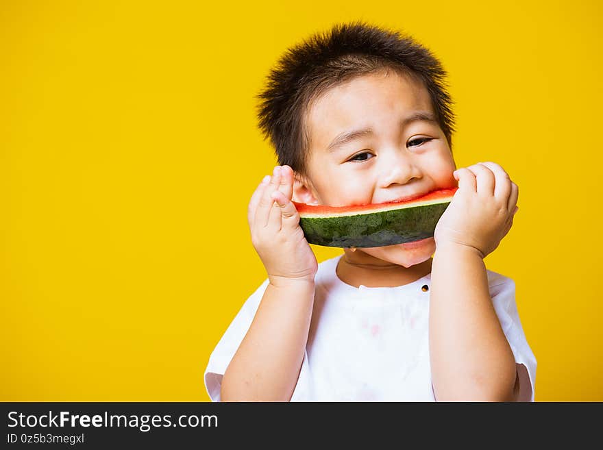 Kid cute little boy attractive laugh smile playing holds cut watermelon fresh for eating