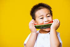 Kid Cute Little Boy Attractive Laugh Smile Playing Holds Cut Watermelon Fresh For Eating Royalty Free Stock Photo