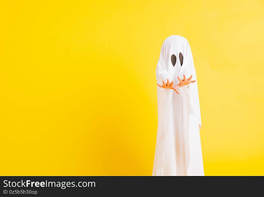 Little cute child with white dressed costume halloween ghost scary