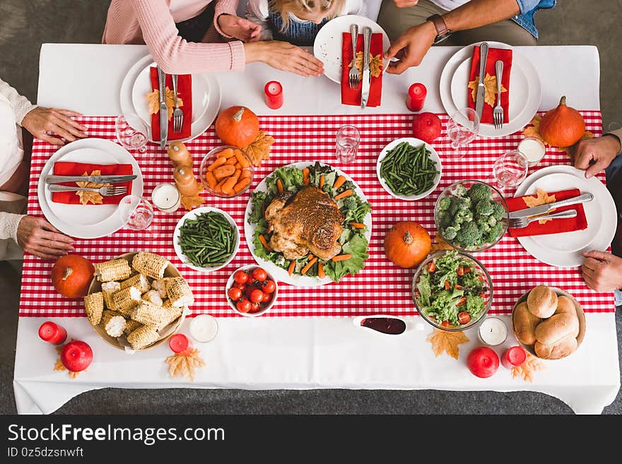 View of family members sitting at table in Thanksgiving day