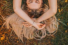 The Girl`s Hair Spread Across The Grass, Royalty Free Stock Photography