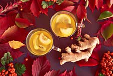 Autumnal Composition With Two Cups Of Ginger Tea Royalty Free Stock Photo