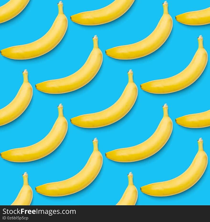 Bananas seamless pattern. pop art bananas pattern. Tropical abstract background with banana. Colorful fruit pattern of yellow banana on blue background, flat lay