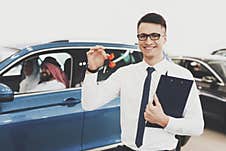 Arab Family Sitting In Car At Dealership. Royalty Free Stock Photo