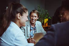 Employees Of The Office Of Different Nationalities At The Business Meeting. Workers At A Meeting In The Office. High Stock Photos